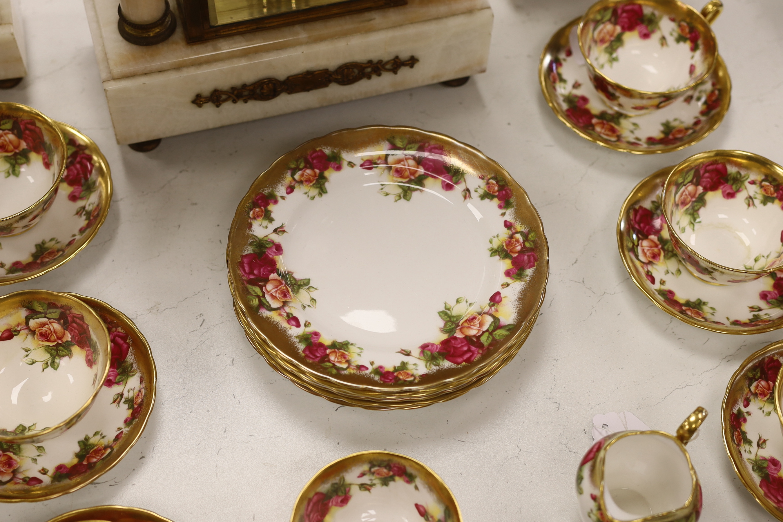 A Royal Chelsea ‘Golden Rose’ pattern part tea service